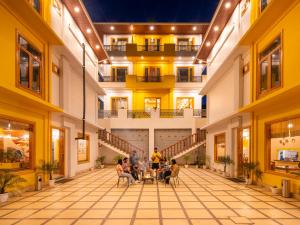 a group of people sitting in a large building at The Hosteller Chakrata in Chakrāta +63 photos