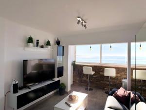 TV a/nebo společenská místnost v ubytování PANORAMIC D-LUXE