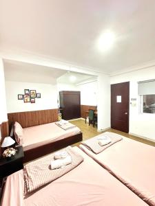Postel nebo postele na pokoji v ubytování Hotel Đông Nhi