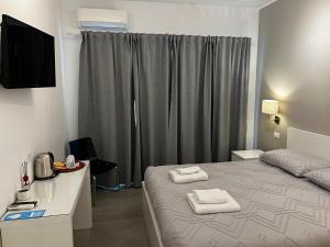 Giường trong phòng chung tại Rome Vatican Rooms