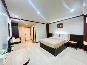 Postel nebo postele na pokoji v ubytování Visanuinn Hotel