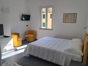 Postel nebo postele na pokoji v ubytování Da Zoe suite fontanavecchia