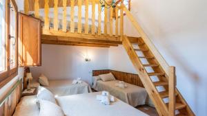 a room with a loft with a bed and a staircase at Casa La Estrella Azul Vélez-Málaga by Ruralidays in Vélez-Málaga +23 photos