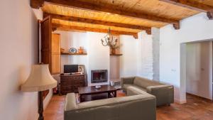 a living room with a couch and a table at Casa La Estrella Azul Vélez-Málaga by Ruralidays in Vélez-Málaga