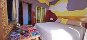 A bed or beds in a room at Accommodation Madre Amada Tenerife