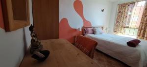 A bed or beds in a room at Accommodation Madre Amada Tenerife
