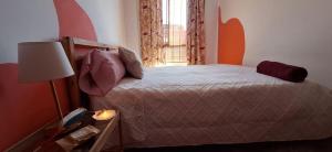 A bed or beds in a room at Accommodation Madre Amada Tenerife