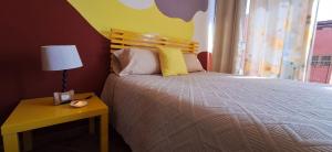 A bed or beds in a room at Accommodation Madre Amada Tenerife