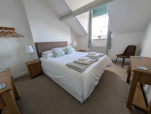 En eller flere senge i et værelse på Eastgate Lodge Flat 23B