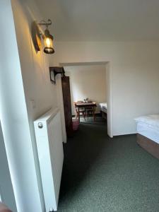 a hallway with a room with a table and a room with a dining room at Luxushütte Welgelegen in Bestwig +8 photos