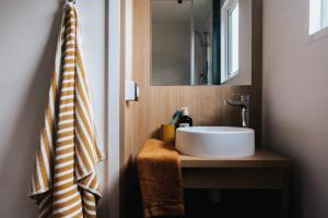 a bathroom with a sink and a mirror at Camping Liberté Verdon in Artignosc-sur-Verdon +47 photos