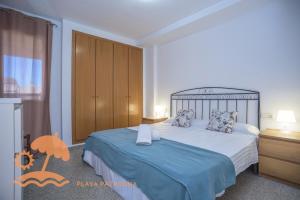 A bed or beds in a room at Patacona Green Holiday