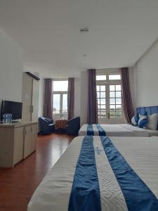 Ένα ή περισσότερα κρεβάτια σε δωμάτιο στο MOUNTIAN TOWN Hotel