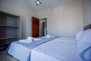 Postel nebo postele na pokoji v ubytování Villa Kotetsi