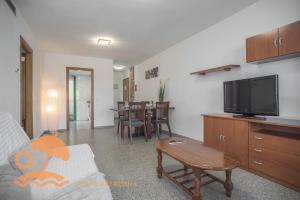 A television and/or entertainment centre at Patacona Green Holiday