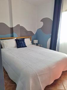 A bed or beds in a room at Accommodation Madre Amada Tenerife