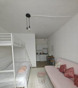 Ένα ή περισσότερα κρεβάτια σε δωμάτιο στο Le studio Mauperthuis