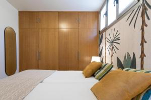 Ένα ή περισσότερα κρεβάτια σε δωμάτιο στο Ático Apartamento Las Burras Playa by VillaGranCanaria +21 φωτογραφίες