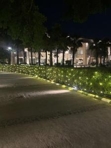 a row of lights on a street at night at Ritz Resort Lucknow- The Perfect Blend of Business and Leisure in Lucknow
