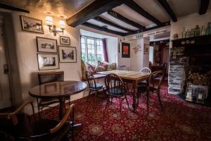 a dining room with a table and chairs at Lifton Hall in Lifton