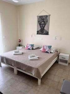 Ένα ή περισσότερα κρεβάτια σε δωμάτιο στο Agelina Apartment