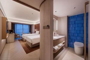Katil atau katil-katil dalam bilik di Orange Crystal Hotel MixC Shantou East Coast