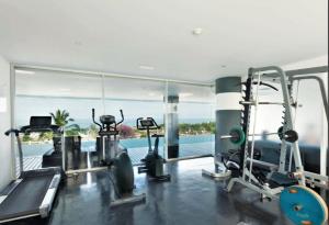 a gym with a view of the water at Sunset Plaza in Ban Karon