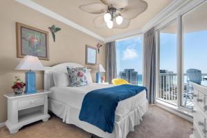 a bedroom with a bed and a large window at St. Lucia 1103 in Destin +53 photos