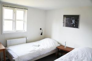 Postel nebo postele na pokoji v ubytování Molslaboratoriet - Lille Studenterhus