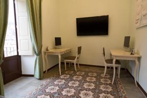 TV a/nebo společenská místnost v ubytování B&B Palazzo Mantegna