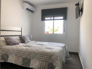 Ένα ή περισσότερα κρεβάτια σε δωμάτιο στο Casa Planta Baja Bungalow 58 +37 φωτογραφίες