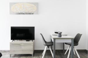 Μια τηλεόραση ή/και κέντρο ψυχαγωγίας στο Casa Planta Baja Bungalow 58