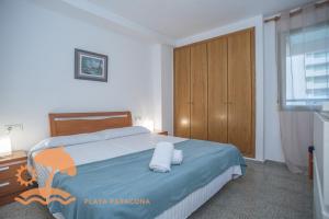 A bed or beds in a room at Patacona Green Holiday