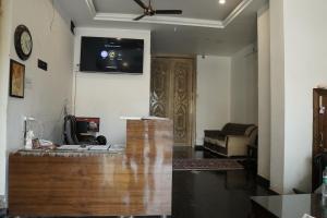 TV a/nebo společenská místnost v ubytování Hotel The Black Gold