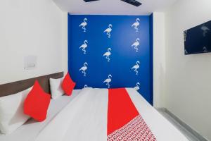 Postel nebo postele na pokoji v ubytování Hotel O JPS PALACE
