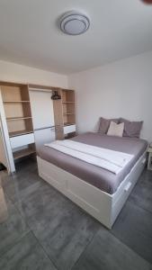 a bedroom with a large bed in a room at Villa familliale Mornas 4 chambres in Mornas