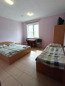 Posteľ alebo postele v izbe v ubytovaní Green Hotel