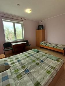 Posteľ alebo postele v izbe v ubytovaní Green Hotel