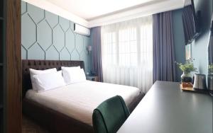 Postel nebo postele na pokoji v ubytování Porta Kavalja Resort