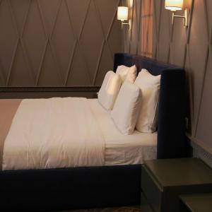 Postel nebo postele na pokoji v ubytování Porta Kavalja Resort