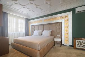 Postel nebo postele na pokoji v ubytování Porta Kavalja Resort