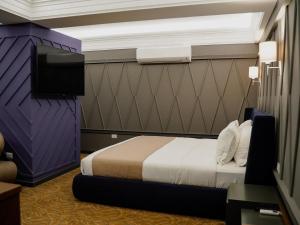 Postel nebo postele na pokoji v ubytování Porta Kavalja Resort