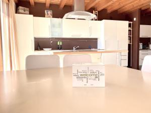 a box sitting on a table in a kitchen at Wohnung Mit Privatem Garten Und Schöner Aussicht in Moniga +31 photos