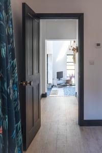 an open door to a room with a living room at Aylesford-House-Sleeps 2 & 1 infant-Parking in Aylesford