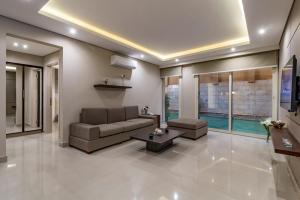 a living room with a couch and a table at Prime Residence New Cairo in Cairo