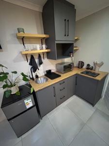 Kuchyň nebo kuchyňský kout v ubytování Perfect Stay Kimberley 2