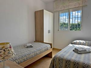 Katil atau katil-katil dalam bilik di Apartamento Arcis - Ole Solutions