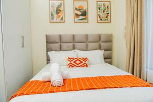 Postel nebo postele na pokoji v ubytování Palm Nest