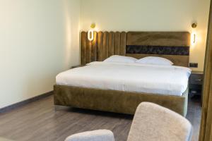 Letto o letti in una camera di Fidji Hotel