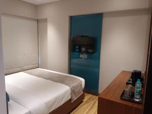 Postel nebo postele na pokoji v ubytování Hotel Flexi Residency Mumbai